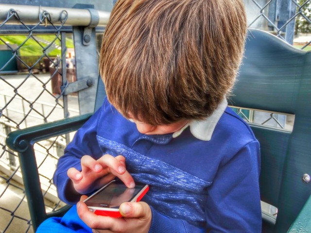 Foap-Young_Boy_Playing_On_A_Smartphone-sm-1024x768